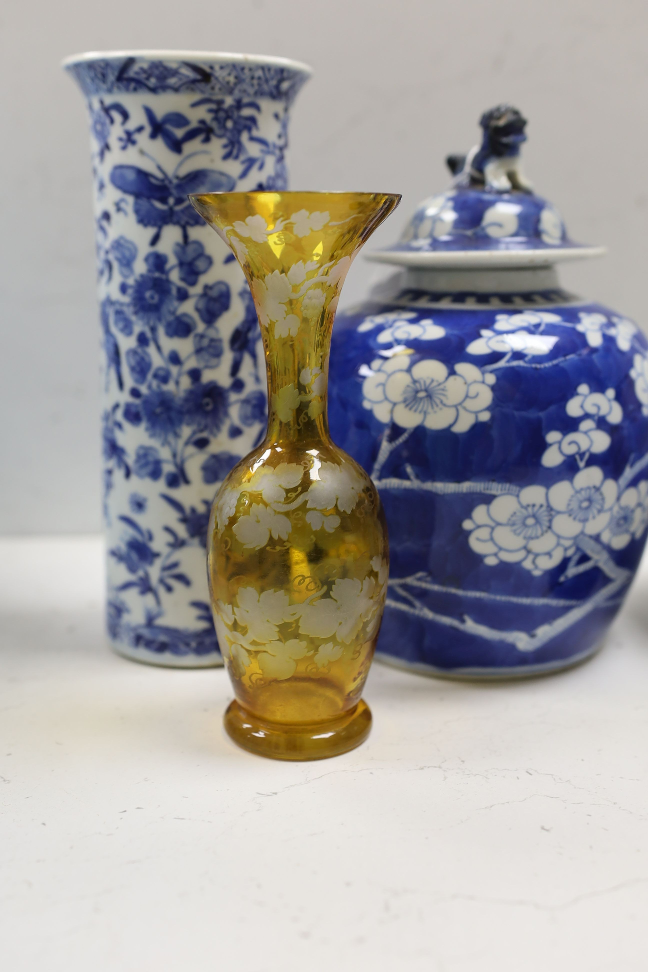 A Chinese famille rose ginger jar, a 19th century Chinese blue and white porcelain jar and cover, a blue and white cylinder vase, a small Chinese dish and orange glass vase (5)